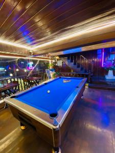 a pool table in a room with a billiardenge at Y&D Hostel in Bangkok