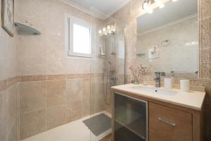 a bathroom with a sink and a shower at Panoramic Sea View Cabo Roig in Orihuela Costa +6 photos