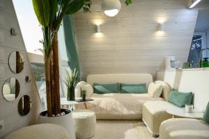 a living room with a couch and a table at White DIAMOND in Chalkidiki in Vergia +82 photos