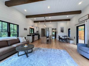 a living room with a couch and a table at Long Lake-Lake Front - in Bridgton