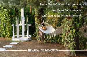 a picture of a hammock in a garden at White DIAMOND in Chalkidiki in Vergia