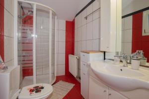 a bathroom with a toilet and a sink and a shower at Alex house in Kouramaditika +33 photos