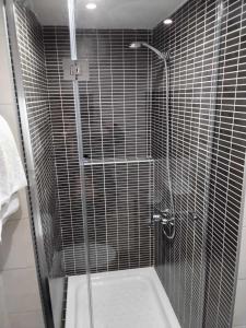 a shower with a glass door in a bathroom at Le Monde SeaView Suites in Nea Kallikrateia +105 photos
