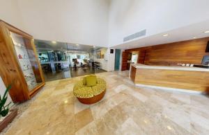a living room with a couch and a chair at Sunscape Dorado Pacifico Ixtapa Resort & Spa- All Inclusive in Ixtapa +56 photos