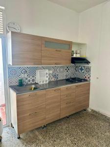 a kitchen with a sink and a counter top at APARTAMENTO COMPLETO, Piedra viva in Zapatoca +9 photos