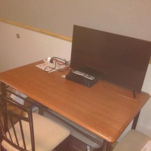 a desk with a laptop computer on top of it at Jasper Way Inn Resort & Campground in Clearwater