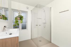 a bathroom with a shower and a sink at Central Apartment - Calm - No traffic in Stavanger +8 photos