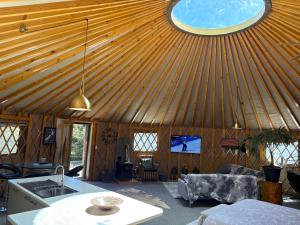 a yurt with a swimming pool on the ceiling at Riverview Yurt in Tarras