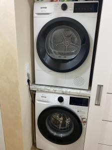 two washing machines stacked on top of each other at Яни Хоум in Gabrovo