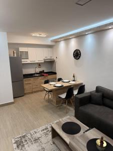 a living room with a couch and a table at Hil Obrenovac in Obrenovac +12 photos