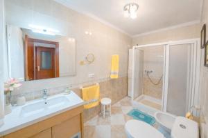a bathroom with a sink and a shower at Villa Campanilla in Olvera +117 photos