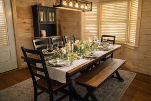 a dining room with a wooden table and chairs at Bella Vista! Long range MTN views, Hot Tub, Close to town and Lake in Blue Ridge