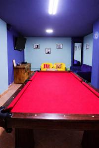 a living room with a large red pool table at Martí in La Paz