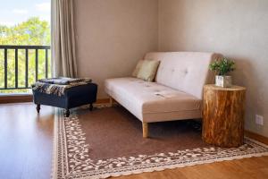a living room with a couch and a coffee table at Sweet Quintanilha in Quintanilha