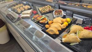 a display case filled with different types of food at B&B Alighieri 97 in Bari