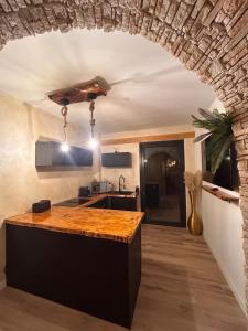 a kitchen with a counter top in a room at Fuera de tiempo in Albalat de la Ribera +26 photos