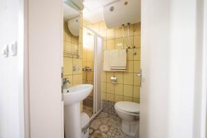 a bathroom with a toilet and a sink at Villa White Lake - Ohrid Center Lakeside Accommodation in Ohrid +24 photos
