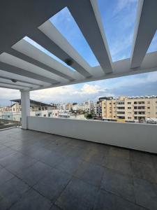 a balcony with a view of a city at Cyprus Apart Hotel in Famagusta