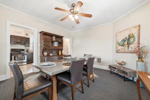 a dining room with a table and a ceiling fan at Spacious & Clean 3BR 2 Balconies Parking in Pittsburgh +15 photos