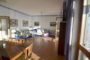 a living room with a couch and a table at Gemelli al Lago in Arona +31 photos