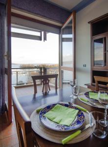a dining room with a table with a view at Gemelli al Lago in Arona