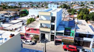an aerial view of a city with a building at Hotel Las Arenitas in Mazatlán