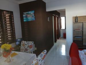 a living room with a table and chairs at Casa praia de Barra nova 6 km de Maceió in Marechal Deodoro