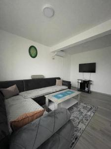 a living room with a couch and a table at L&L in Sarajevo