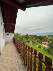 a balcony with a view of a field at L&L in Sarajevo