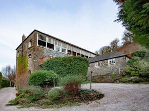 an old stone house with a large building at Tuckenhay, Mill House - Fub in Ashsprington +63 photos
