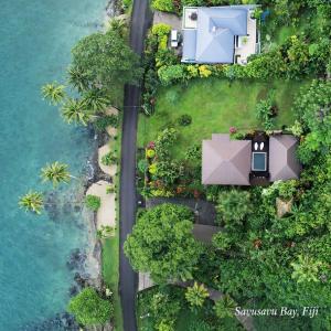 an aerial view of a house and the ocean at Luxury Ocean View Villa, Savusavu Bay, Blue Bayou Bure with Starlink in Savusavu