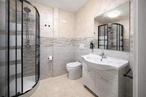 a bathroom with a sink and a toilet and a shower at Appio Rooms Haven in Rome