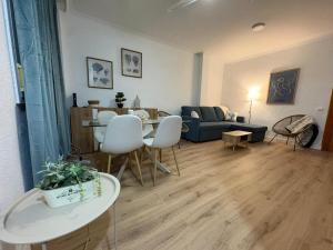 a living room with a table and a couch at Ikigai Home in La Rábita