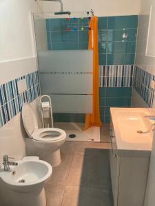 a bathroom with a toilet and a sink and a shower at Villa Marine Plus in Fontane Bianche +22 photos