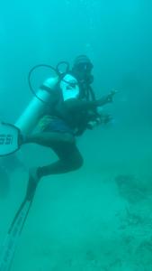 a woman in the water with aqual at Villa Homestay in Mesemta