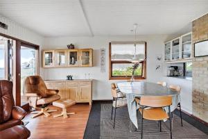a kitchen and dining room with a table and chairs at 30711-Odder-Skovgardsparken-1 in Odder +16 photos