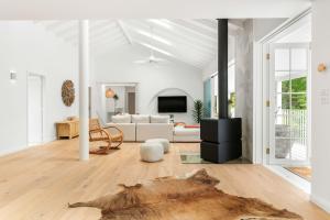 a living room with a couch and a table at Casa Scenic MacMasters Beach in Macmasters Beach