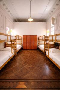 a room with four bunk beds in it at 1900 Backpacker's Hostel in Lima