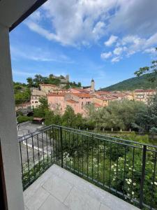 a balcony with a view of a city at Casa dei pazzi Montanari da Cristina in Alfedena
