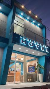a building with a sign that reads hotel at Hotel Urban Biz in Pilar
