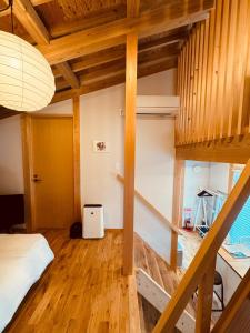 a bedroom with a bunk bed and wooden floors at Tiny House - Vacation STAY 12059v in Ōtakuchi