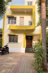 a scooter parked in front of a building at Singh ManSion in Purnea