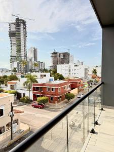 a view of a city from the balcony of a building at Comfort stay Mazatlan in Mazatlán