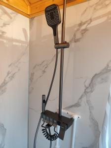 a hair dryer hanging on a wall in a room at Noygut in Dzhetyoguz