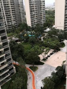 an aerial view of a park in a city with tall buildings at Miri apartment in Kunming