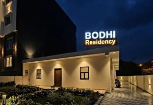 a building with a sign on top of it at BODHI Residency in Greater Noida +3 photos