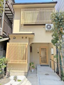 a house with wooden panels on the side of it at 東寺の宿夏 in Kyoto