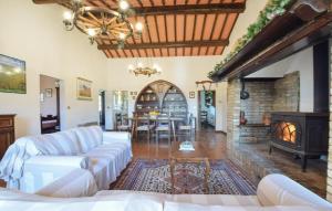 a living room with a couch and a fireplace at Umbria Magione Podere C in Magione