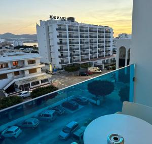 a balcony with a view of a parking lot at Aparthotel Boutique Poniente Playa in San Antonio