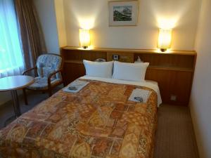 Katil atau katil-katil dalam bilik di Hotel New Green Kashiwazaki +40 gambar